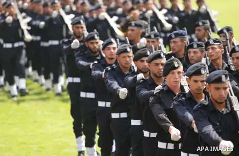 Palestinian policemen take part in a graduation ceremony, in Gaza City on July 17, 2017. Photo by Ashraf Amra