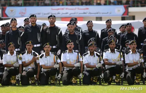 Palestinian policemen take part in a graduation ceremony, in Gaza City on July 17, 2017. Photo by Ashraf Amra