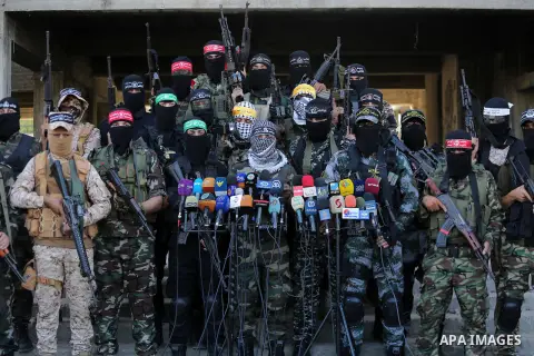 Palestinian militants from different local factions hold a press conference to refuse closure of the Al-Aqsa Mosque compound by Israel in Gaza City on July 18, 2017. Photo by Mohammed Asad