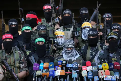 Palestinian militants from different local factions hold a press conference to refuse closure of the Al-Aqsa Mosque compound by Israel in Gaza City on July 18, 2017. Photo by Mohammed Asad