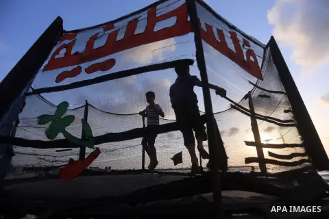 Palestinians enjoy their time at the beach of the Mediterranean sea on the coast of Gaza city on July 19, 2017. Photo by Yasser Qudih