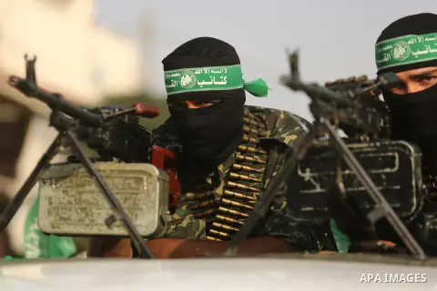 Palestinian Hamas militants take part in a military show against Israel's newly-installed security measures at the entrance to the al-Aqsa mosque compound, in Khan Younis, in the southern Gaza Strip July 20, 2017. Photo...