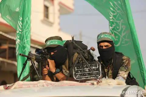 Palestinian Hamas militants take part in a military show against Israel's newly-installed security measures at the entrance to the al-Aqsa mosque compound, in Khan Younis, in the southern Gaza Strip July 20, 2017. Photo...
