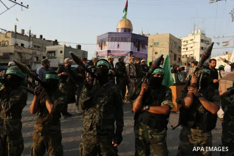 Palestinian Hamas militants take part in a military show against Israel's newly-installed security measures at the entrance to the al-Aqsa mosque compound, in Khan Younis, in the southern Gaza Strip July 20, 2017. Photo...