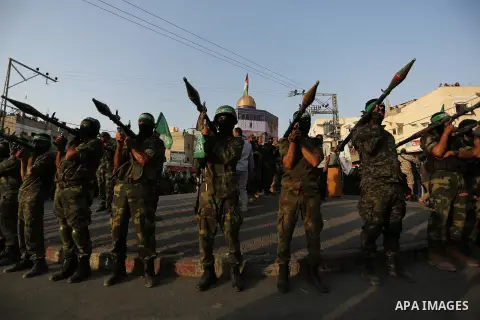 Palestinian Hamas militants take part in a military show against Israel's newly-installed security measures at the entrance to the al-Aqsa mosque compound, in Khan Younis, in the southern Gaza Strip July 20, 2017. Photo...