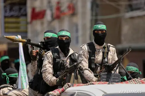 Palestinian Hamas militants take part in a protest against Israel's new security measures at the entrance to the al-Aqsa mosque compound, which include metal detectors and cameras, in Khan Younis in the the southern Gaza...