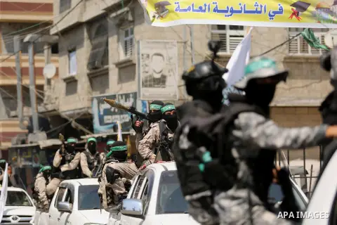 Palestinian Hamas militants take part in a protest against Israel's new security measures at the entrance to the al-Aqsa mosque compound, which include metal detectors and cameras, in Khan Younis in the the southern Gaza...