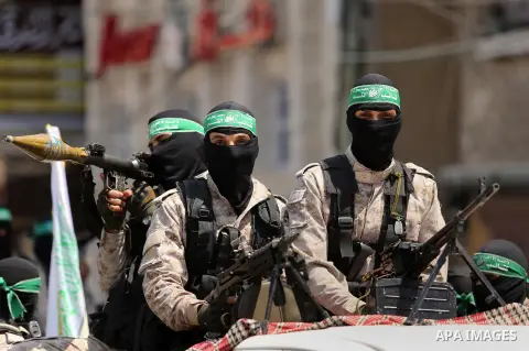 Palestinian Hamas militants take part in a protest against Israel's new security measures at the entrance to the al-Aqsa mosque compound, which include metal detectors and cameras, in Khan Younis in the the southern Gaza...