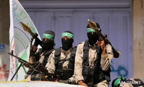 Palestinian Hamas militants take part in a protest against Israel's new security measures at the entrance to the al-Aqsa mosque compound, which include metal detectors and cameras, in Khan Younis in the the southern Gaza...