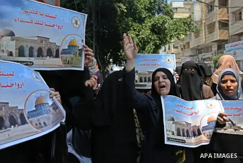 Palestinian supporters of Islamic Jihad take part in a protest against Israel's new security measures at the entrance to the al-Aqsa mosque compound, which include metal detectors and cameras, in Gaza City on July 23, 20...