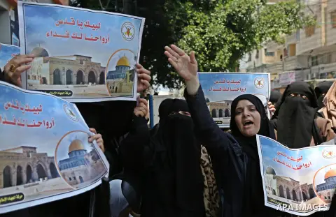 Palestinian supporters of Islamic Jihad take part in a protest against Israel's new security measures at the entrance to the al-Aqsa mosque compound, which include metal detectors and cameras, in Gaza City on July 23, 20...