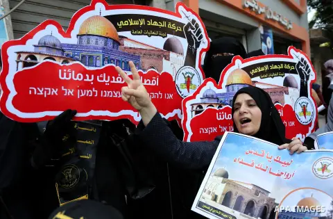 Palestinian supporters of Islamic Jihad take part in a protest against Israel's new security measures at the entrance to the al-Aqsa mosque compound, which include metal detectors and cameras, in Gaza City on July 23, 20...