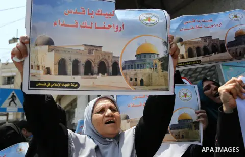 Palestinian supporters of Islamic Jihad take part in a protest against Israel's new security measures at the entrance to the al-Aqsa mosque compound, which include metal detectors and cameras, in Gaza City on July 23, 20...