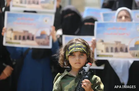 Palestinian supporters of Islamic Jihad take part in a protest against Israel's new security measures at the entrance to the al-Aqsa mosque compound, which include metal detectors and cameras, in Gaza City on July 23, 20...