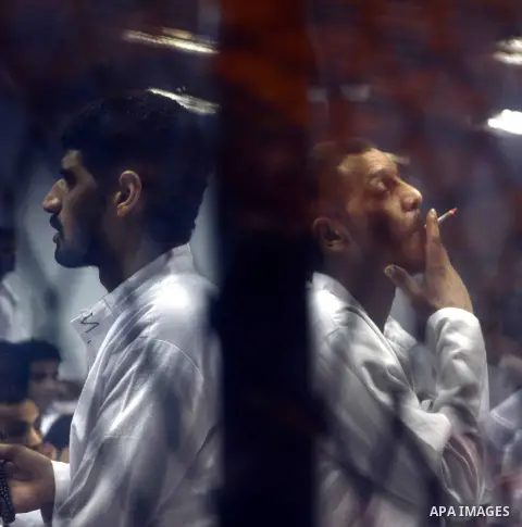 Egyptian defendants sits behind the defendant's bars during their trial at "Cabinet Incidents" case at the court in Cairo, Egypt, on July 25, 2017. An Egyptian criminal court sentenced 43 activists to life in prison on T...