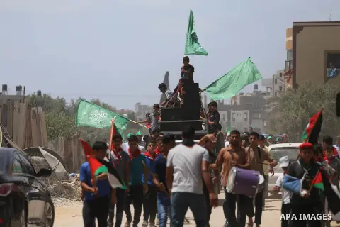 Palestinian supporters of Hamas movement and Islamic Jihad take part in a protest against the recent closure of the Al-Aqsa Mosque compound by Israel, in Jabalia refugee camp in the northern Gaza strip, on July 23, 2017....