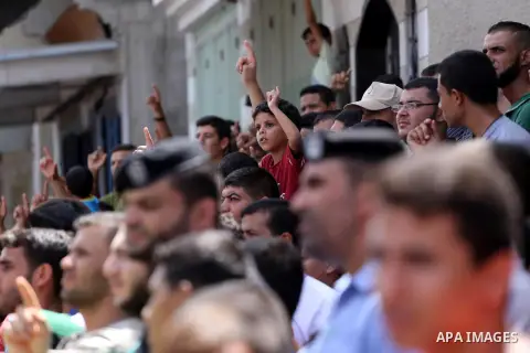 Palestinian supporters of Hamas movement and Islamic Jihad take part in a protest against the recent closure of the Al-Aqsa Mosque compound by Israel, in Jabalia refugee camp in the northern Gaza strip, on July 23, 2017....