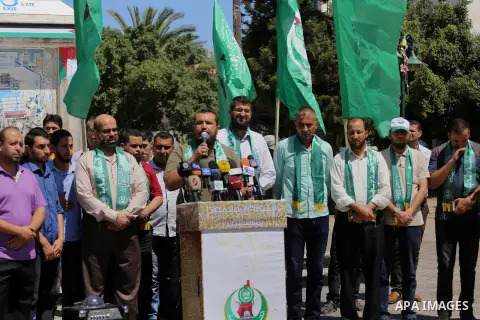 Palestinian supporters of Hamas movement take part during a rally to celebrate marking Israel's removal of all security measures it had installed that were implemented at the Al-Aqsa mosque compound in Jerusalem, in Gaza...
