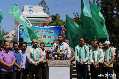 Palestinian supporters of Hamas movement take part during a rally to celebrate marking Israel's removal of all security measures it had installed that were implemented at the Al-Aqsa mosque compound in Jerusalem, in Gaza...