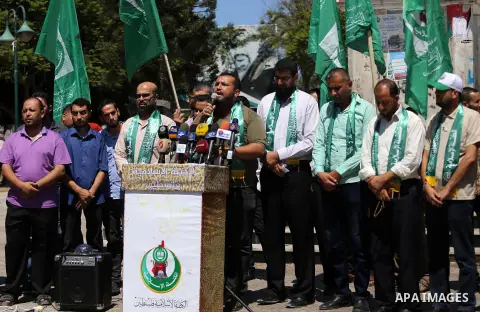 Palestinian supporters of Hamas movement take part during a rally to celebrate marking Israel's removal of all security measures it had installed that were implemented at the Al-Aqsa mosque compound in Jerusalem, in Gaza...