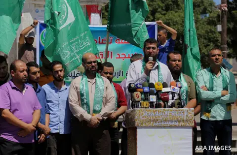 Palestinian supporters of Hamas movement take part during a rally to celebrate marking Israel's removal of all security measures it had installed that were implemented at the Al-Aqsa mosque compound in Jerusalem, in Gaza...