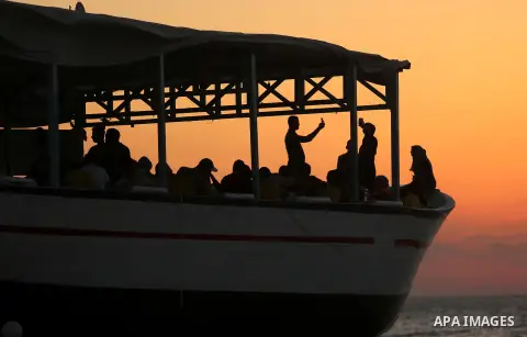 Palestinians are seen aboard "Lolo Rose" ship which has become a popular restaurant, on a beach in Gaza City on August 4, 2017. Photo by Ashraf Amra