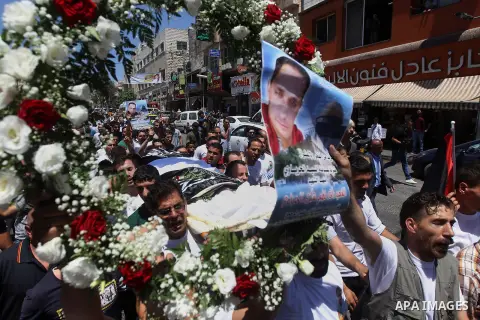 Palestinians carry the body of Palestinian Rafat Herbawi who had been killed in July 19 by Israeli soldiers after allegedly attempting car- ramming attack during his funeral in the West Bank of Hebron, on August 5, 2017....