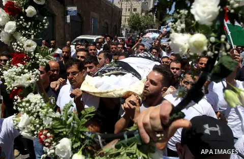 Palestinians carry the body of Palestinian Rafat Herbawi who had been killed in July 19 by Israeli soldiers after allegedly attempting car- ramming attack during his funeral in the West Bank of Hebron, on August 5, 2017....