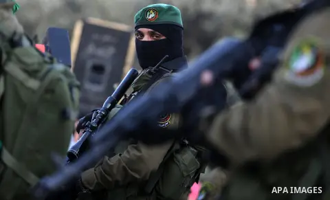 Members of the Ezzedine al-Qassam Brigades, the military wing of the Palestinian Islamist movement Hamas take part during the opening ceremony of Mazen Faqha square, in Nusseirat refugee camp, in the central Gaza Strip,...