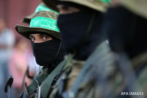Members of the Ezzedine al-Qassam Brigades, the military wing of the Palestinian Islamist movement Hamas take part during the opening ceremony of Mazen Faqha square, in Nusseirat refugee camp, in the central Gaza Strip,...