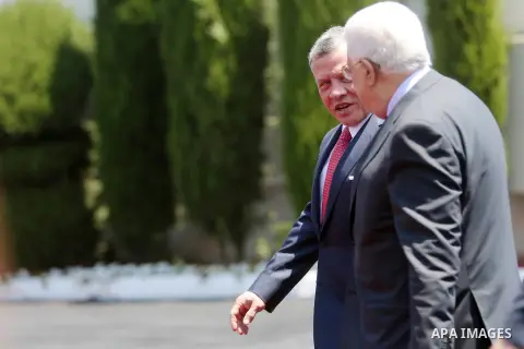 Jordan's King Abdullah II and Palestinian president Mahmud Abbas observes the honor guard during a visit in the West Bank city of Ramallah on August 7, 2017. Jordan's King began a rare visit to the occupied West Bank to...