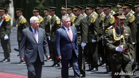 Jordan's King Abdullah II and Palestinian president Mahmud Abbas observes the honor guard during a visit in the West Bank city of Ramallah on August 7, 2017. Jordan's King began a rare visit to the occupied West Bank to...