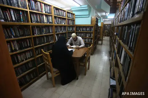 Palestinian researchers read books at Nablus public library in the West Bank city of Nablus, on August 6, 2017. Nablus public library, the largest, and the oldest, in all of Palestine, opened in 1960, and library include...