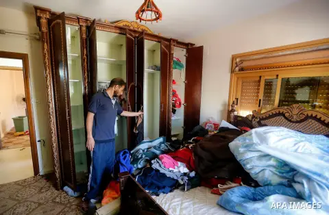Palestinians check a damage after the Israeli army stormed the house and arrested two people, in the West Bank city of Hebron, on August 8, 2017. Israeli army stormed two house in the last night in hebron search for weap...