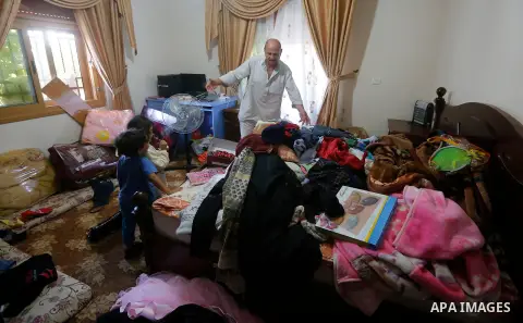 Palestinians check a damage after the Israeli army stormed the house and arrested two people, in the West Bank city of Hebron, on August 8, 2017. Israeli army stormed two house in the last night in hebron search for weap...