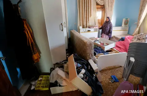 Palestinians check a damage after the Israeli army stormed the house and arrested two people, in the West Bank city of Hebron, on August 8, 2017. Israeli army stormed two house in the last night in hebron search for weap...