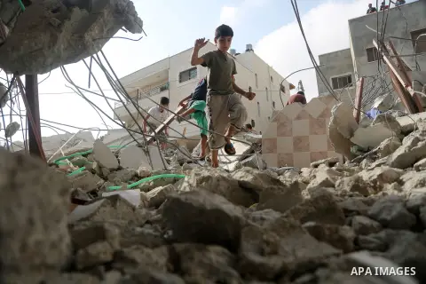 People gather around the remains of the house of a Palestinian assailant after it was demolished by Israeli troops in the West Bank village of Deir Abu Mashal, near Ramallah August 10, 2017. Photo by Shadi Hatem