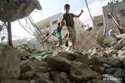 People gather around the remains of the house of a Palestinian assailant after it was demolished by Israeli troops in the West Bank village of Deir Abu Mashal, near Ramallah August 10, 2017. Photo by Shadi Hatem