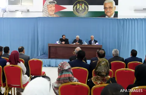 Palestinian President Mahmoud Abbas meets with Palestinian teachers who will be send to Kuwait, in the West Bank city of Ramallah, on August 12, 2017. Photo by Osama Falah