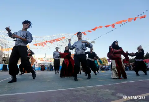 Palestinian youth perform traditional Palestinian dance during the Festival of the movement of Palestinian National Initiative Mustafa Barghouti in West Bank city of Bethlehem on August 12, 2017. Photo by Wisam Hashlamou...