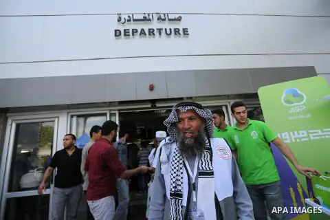 Palestinian Muslim pilgrims arrive at the Rafah border crossing between Egypt and the southern Gaza Strip, on August 14, 2017, ahead of their departure to the annual Hajj pilgrimage in Saudi Arabia's holy city of Mecca....