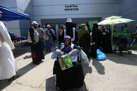 Palestinian Muslim pilgrims arrive at the Rafah border crossing between Egypt and the southern Gaza Strip, on August 14, 2017, ahead of their departure to the annual Hajj pilgrimage in Saudi Arabia's holy city of Mecca....