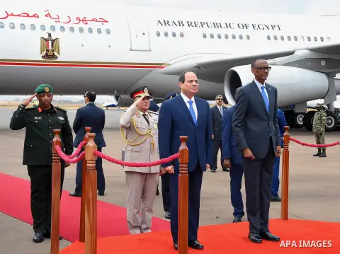 Egyptian President Abdel Fattah al-Sisi and Rwandan President Paul Kagame inspect a guard of honour after al-Sisi's arrival at Kigali International Airport on August 15, 2017. The Egyptian President is paying a two day v...