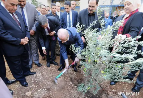 Palestinian Prime Minister, Rami Hamdallah, opens the new branch of Khadouri University, in the West Bank city of Ramallah, on August 23, 2017. Photo by Prime Minister Office