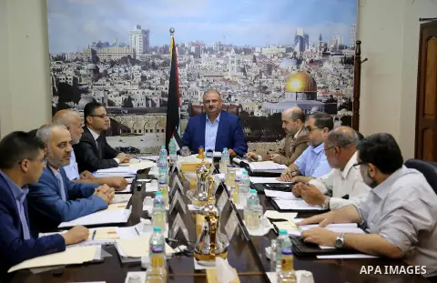 The Chairman of the Administrative Committee in Gaza strip Abdul Salam Siam, chairs a meeting for Administrative Committee, in Gaza city on August 29, 2017. Photo by Atia Darwish