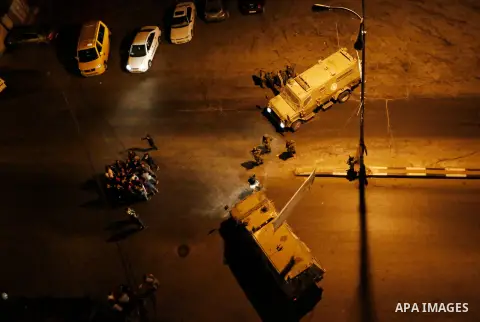 Israeli forces take postion outside Al Huriya radio station for the closure over charges of incited violence, in West Bank city of Hebron on August 30, 2017 . Photo by Wisam Hashlamoun
