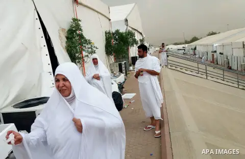 Muslim pilgrims rest near Mount Arafat, also known as Jabal al-Rahma (Mount of Mercy), southeast of the Saudi holy city of Mecca, on Arafat Day which is the climax of the Hajj pilgrimage early on August 31, 2017. Arafat...