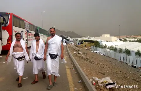 Muslim pilgrims walk near Mount Arafat, also known as Jabal al-Rahma (Mount of Mercy), southeast of the Saudi holy city of Mecca, on Arafat Day which is the climax of the Hajj pilgrimage early on August 31, 2017. Arafat...
