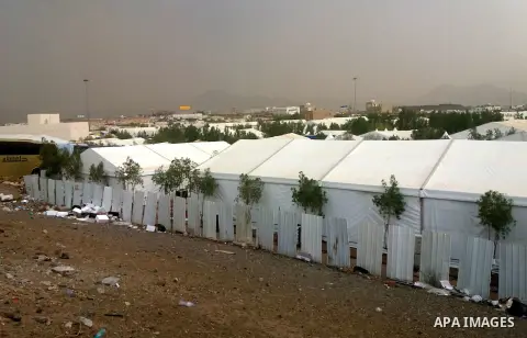 Muslim pilgrims rest near Mount Arafat, also known as Jabal al-Rahma (Mount of Mercy), southeast of the Saudi holy city of Mecca, on Arafat Day which is the climax of the Hajj pilgrimage early on August 31, 2017. Arafat...