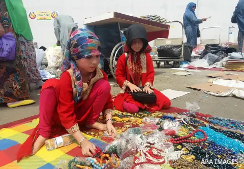 Muslim pilgrims shop on the secund day of Eid al-Adha at a market near the holy city of Mecca, on September 2, 2017. Muslims around the world are celebrating Eid al-Adha, the "Feast of Sacrifice", which marks the end of...